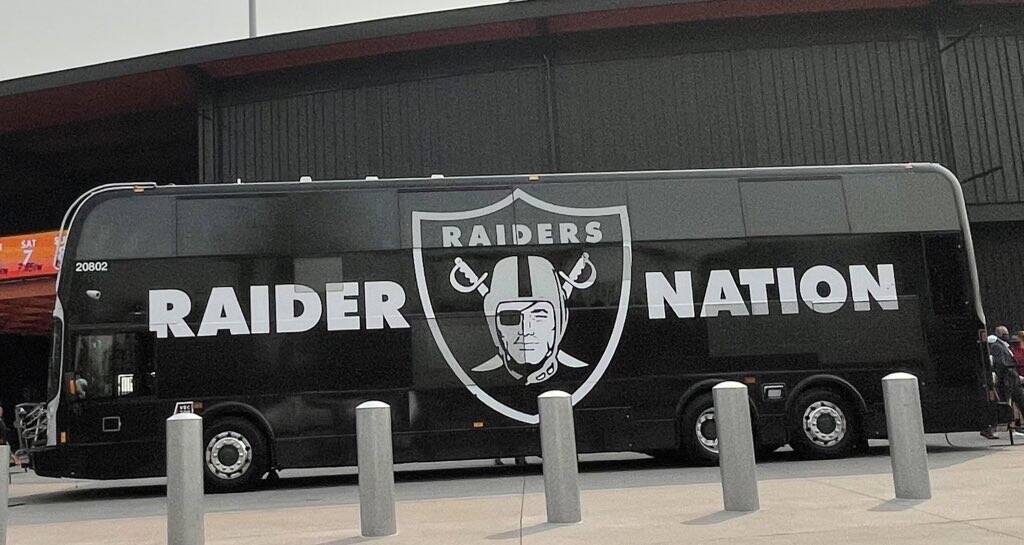 RTC bus decked out in a Raiders wrap that is part of the RTC's Game Day Express transit system ...