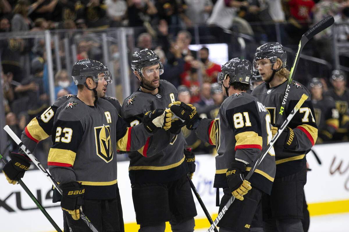 Golden Knights defenseman Alex Pietrangelo (7) fist-bumps center Jonathan Marchessault (81) and ...