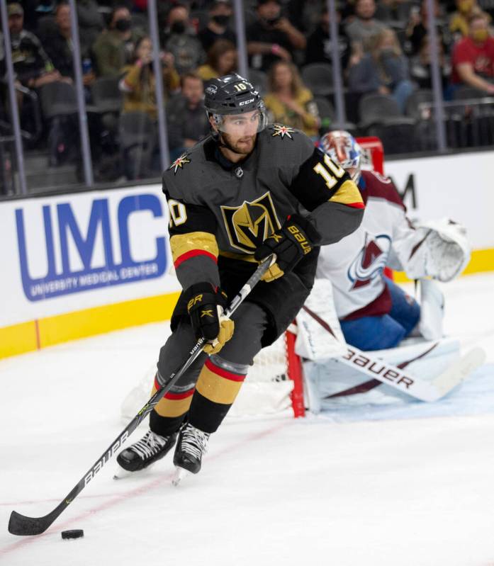 Golden Knights right wing Reilly Smith (19) skates around Avalanche goaltender Jonas Johansson ...