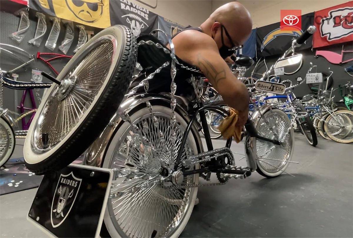 Chino Lim shines his custom low-rider bicycle. He is a member of Riderz4Life. (K.M. Cannon/Las ...