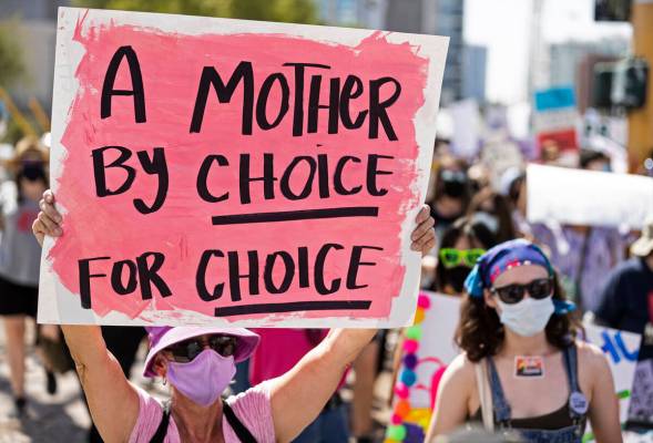 Demonstrators gather outside the Lloyd D George Courthouse during a March for Reproductive Righ ...