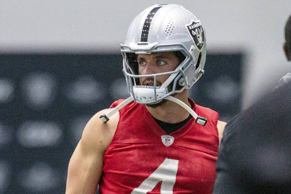 Raiders quarterback Derek Carr (4) looks on during a practice session at the Raiders Headquarte ...