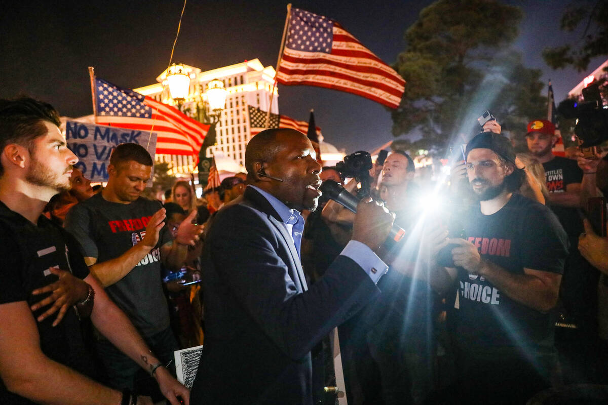 Mack Miller, a Republican candidate for lieutenant governor, addresses the crowd protesting COV ...