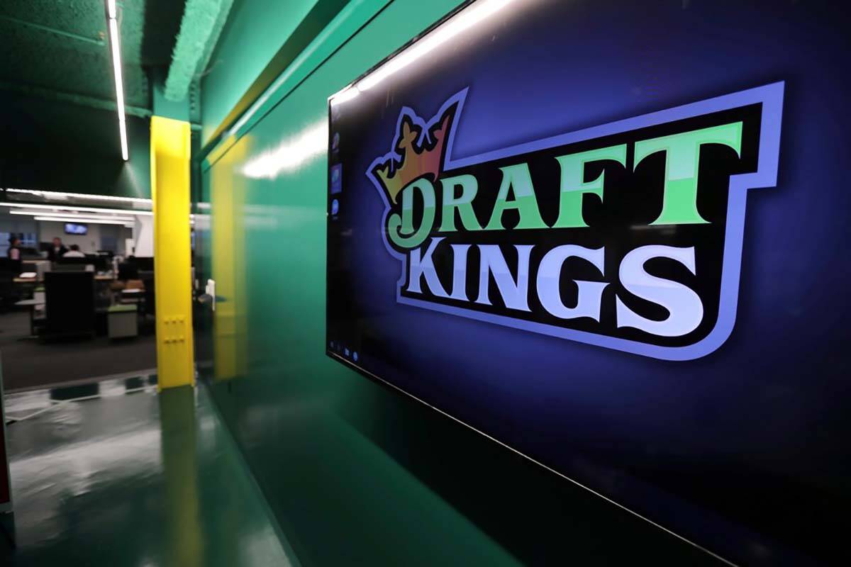 FILE - In this May 2, 2019, file photo, the DraftKings logo is displayed at the sports betting ...