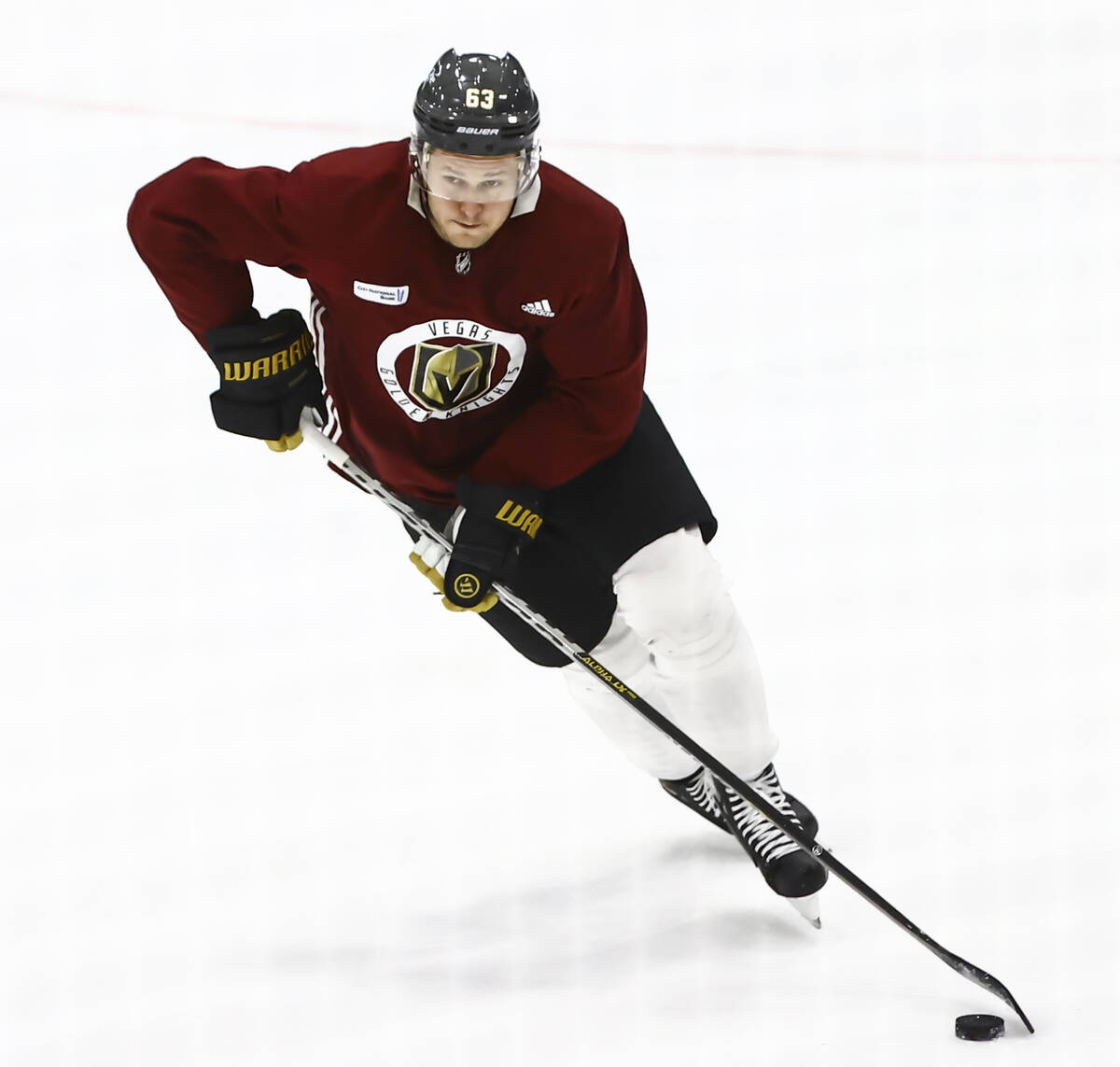 Golden Knights' Evgenii Dadonov (63) skates with the puck during the first on-ice day of traini ...