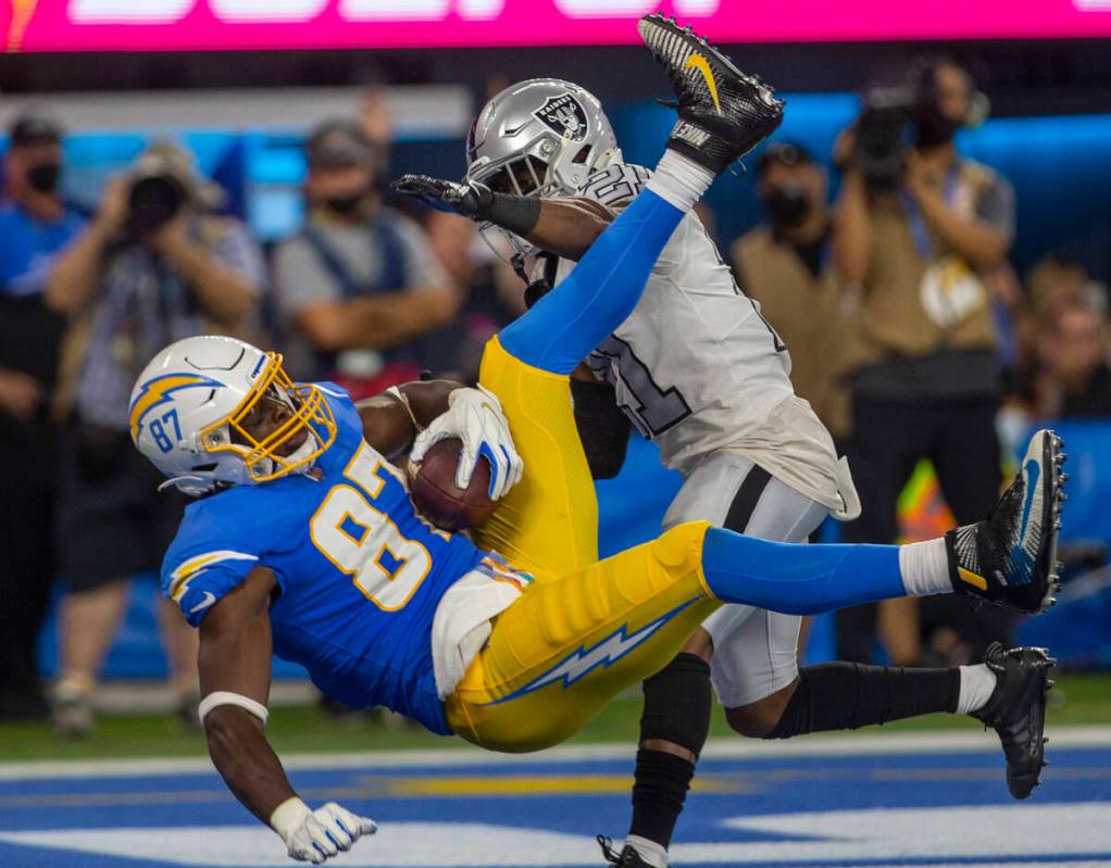 Los Angeles Chargers tight end Jared Cook (87) scores a touchdown over Raiders cornerback Amik ...