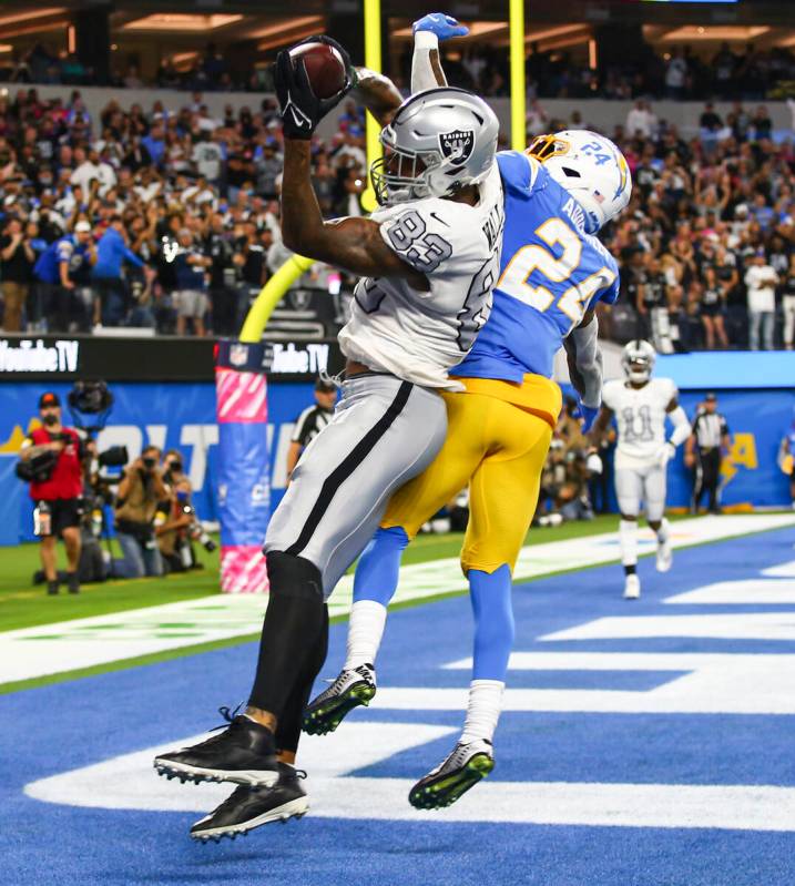 Raiders tight end Darren Waller (83) pulls in a touchdown pass against Los Angeles Chargers def ...