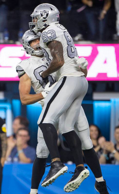 Raiders tight end Darren Waller (83) celebrates a touchdown catch with Raiders tight end Foster ...