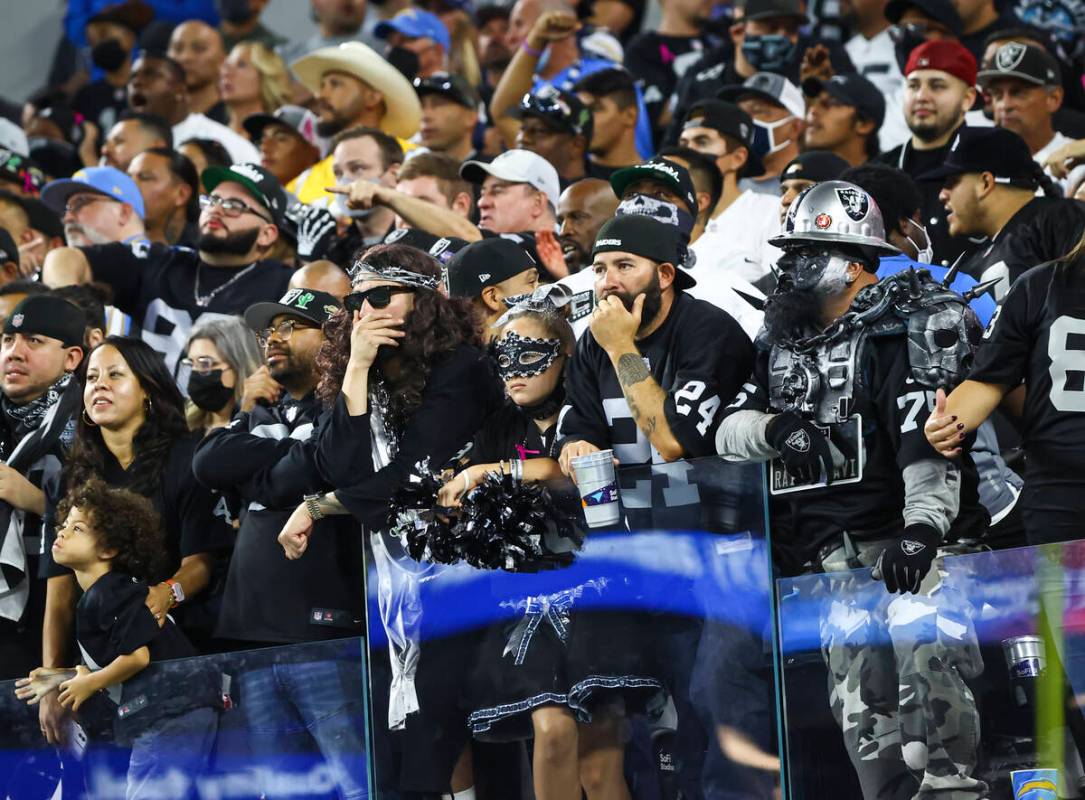 Raiders fans look on as they trail the Los Angeles Chargers during the second half of an NFL ga ...