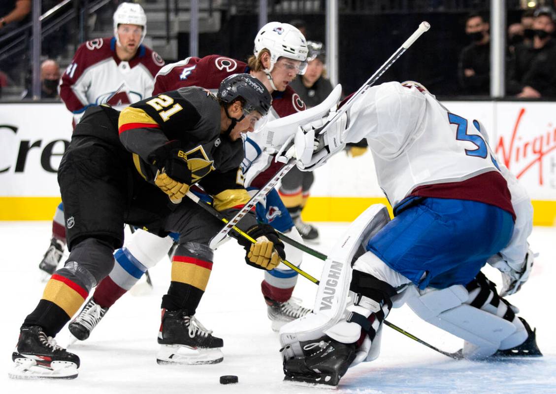 Golden Knights center Brett Howden (21) attempts a goal on Avalanche goaltender Jonas Johansson ...