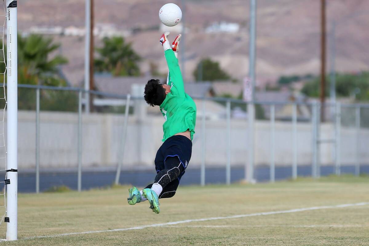 Centennial's goalkeeper Julian Gugino (1) makes a save during the first half of a soccer game a ...