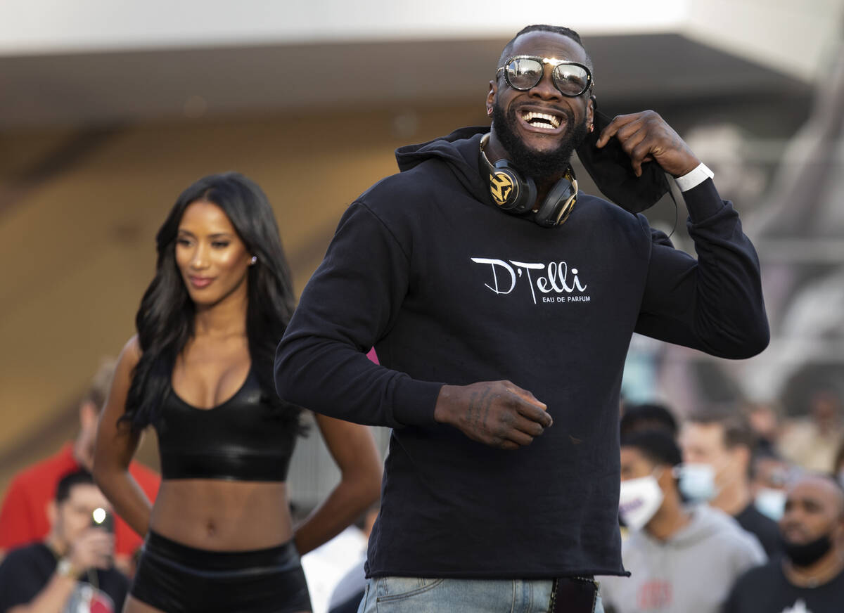 Heavyweight champion Deontay Wilder takes his mask off for a press conference at Toshiba Plaza ...