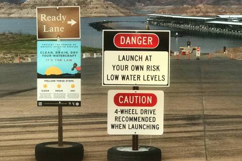Signs warning of low-water conditions greet boaters at the Hemenway Harbor Launch Ramp at the L ...