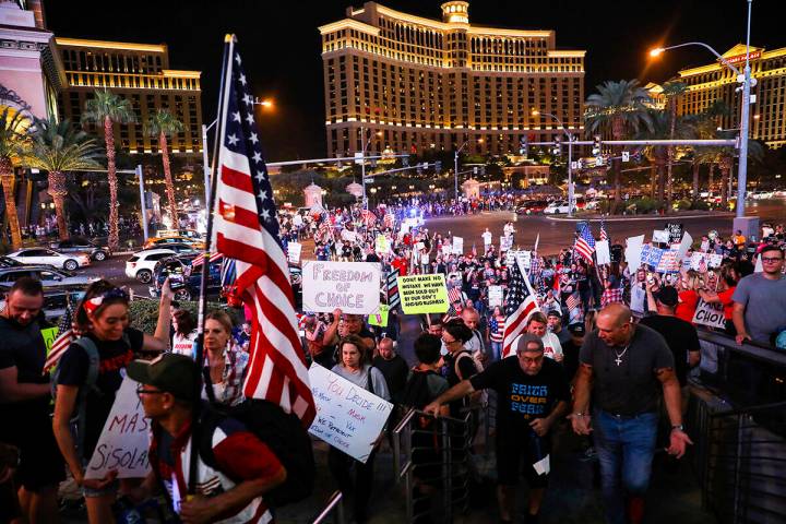 Protesters walk the Strip to protest COVID-19 government mandates, hosted by the non-profit Fre ...