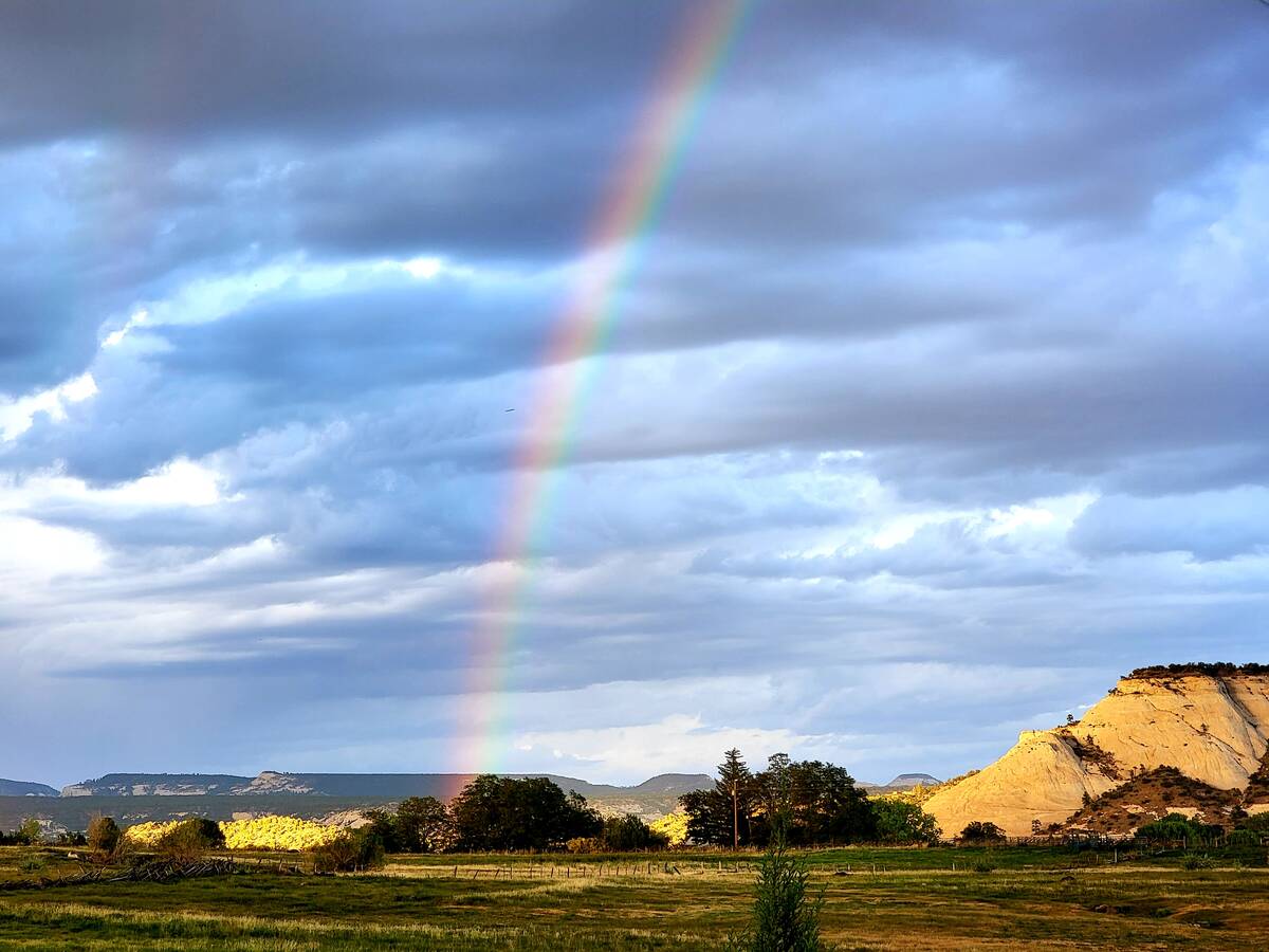 An after-dinner rainbow on display from a field behind Hell’s Backbone Grill and Boulder Moun ...