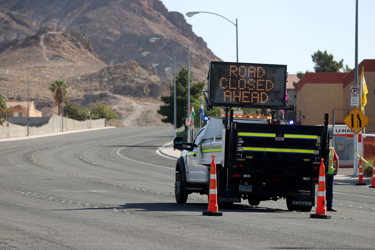 Nevada Department of Transportation workers close Lake Mead Boulevard at Los Feliz Street in La ...