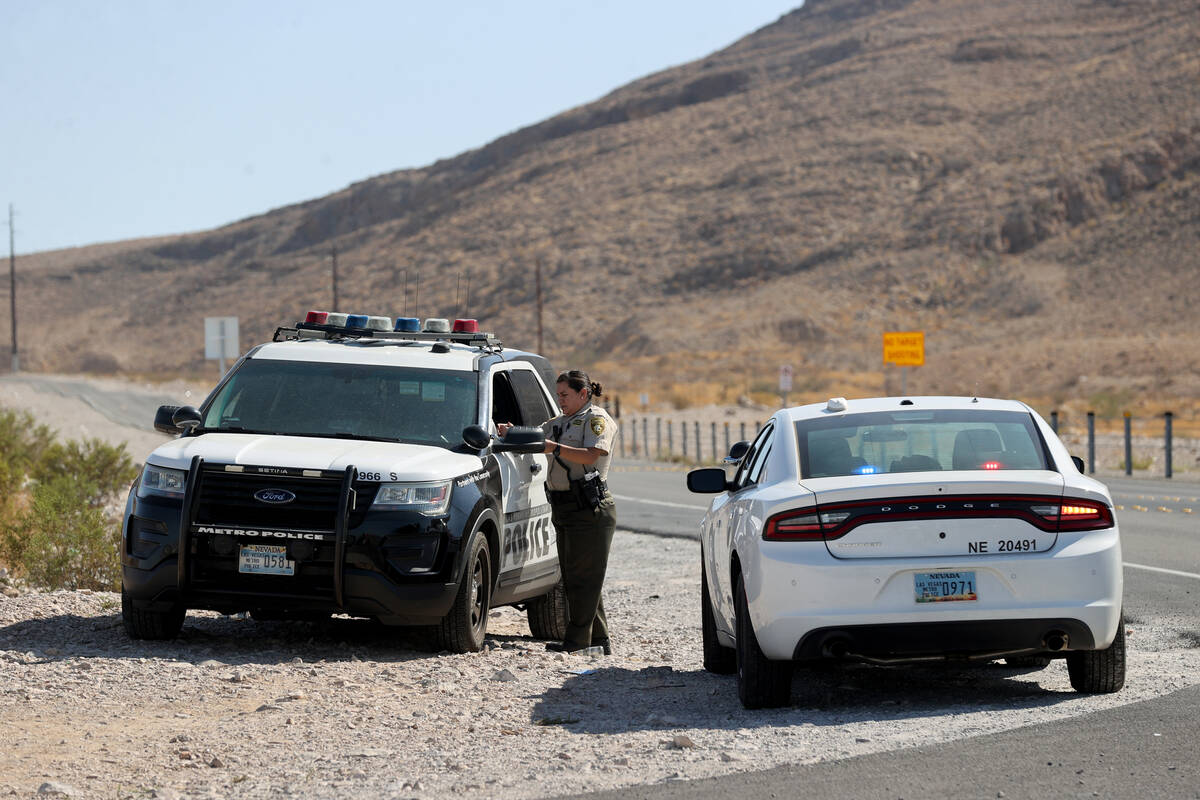 Las Vegas police close Lake Mead Boulevard at Arnona Road in Las Vegas Sunday, Oct. 3, 2021, as ...