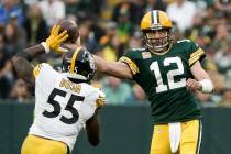 Green Bay Packers' Aaron Rodgers throws past Pittsburgh Steelers' Devin Bush during the second ...