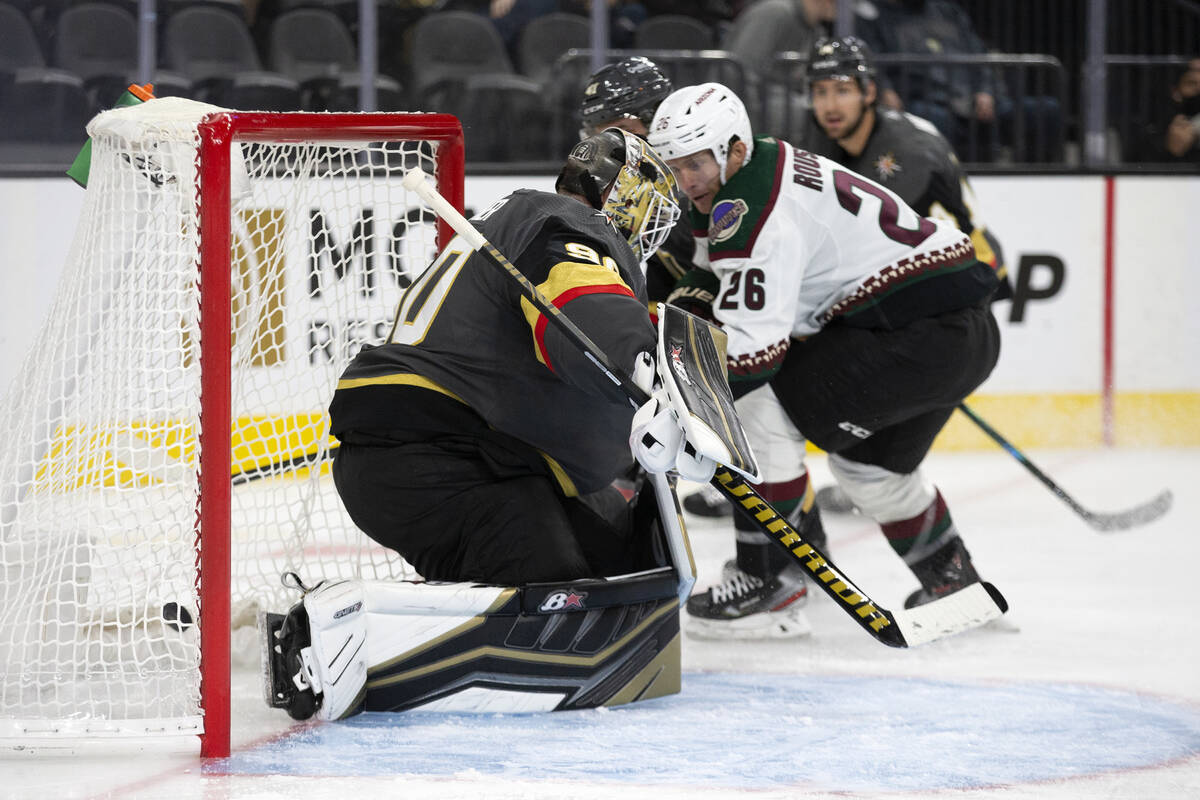 Golden Knights goaltender Robin Lehner (90) lets in a goal shot by Coyotes left wing Antoine Ro ...