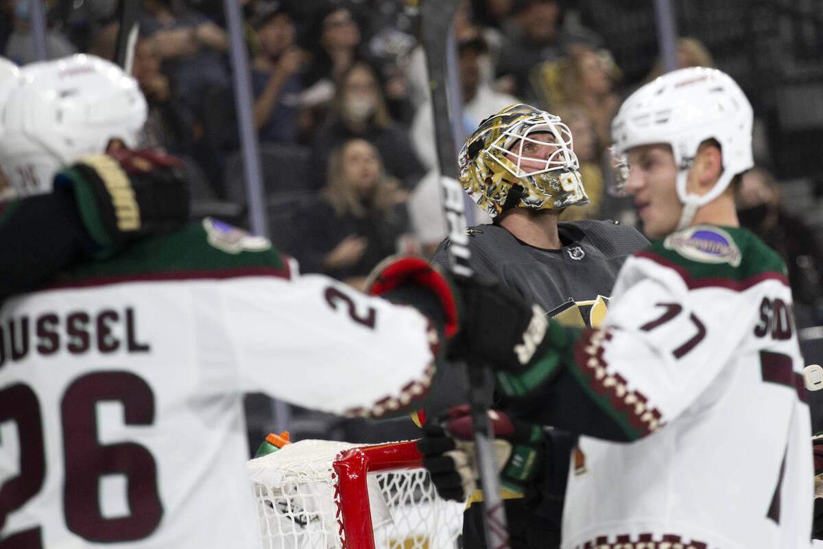 Golden Knights goaltender Robin Lehner (90) looks up as Coyotes defenseman Victor Soderstrom (7 ...