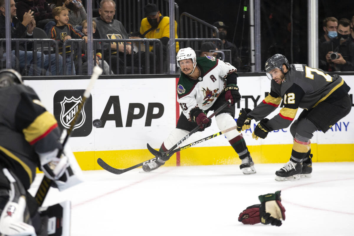 Coyotes center Jay Beagle (83) takes a shot on Golden Knights goaltender Robin Lehner (90) as G ...