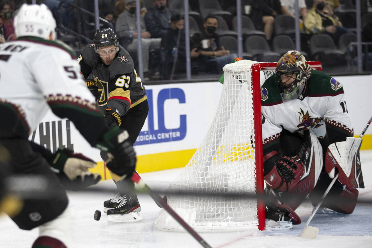 Golden Knights right wing Evgenii Dadonov (63) looks to pass while Coyotes goaltender Karel Vej ...