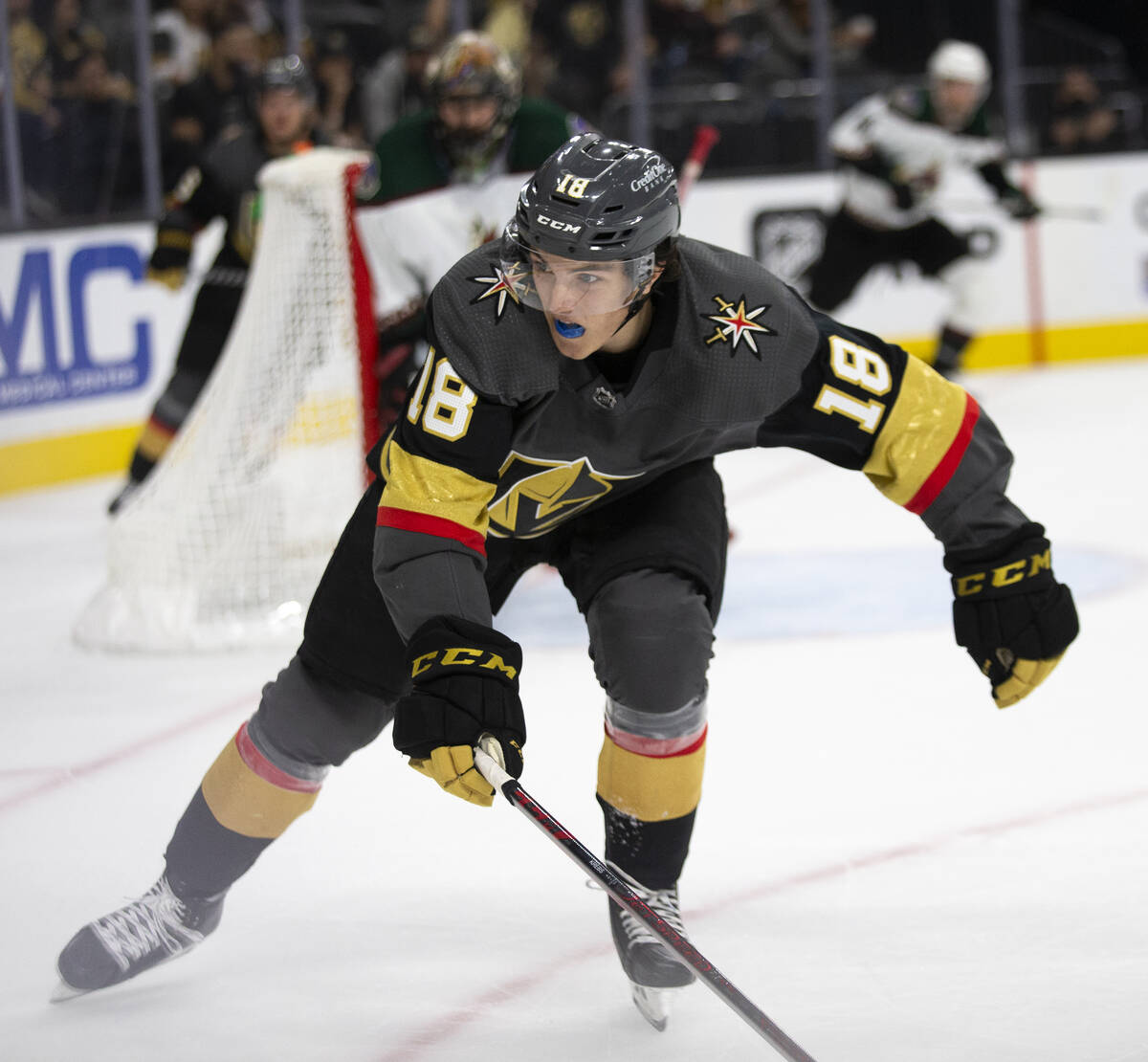 Golden Knights left wing Peyton Krebs (18) skates for the puck during the third period of a pre ...