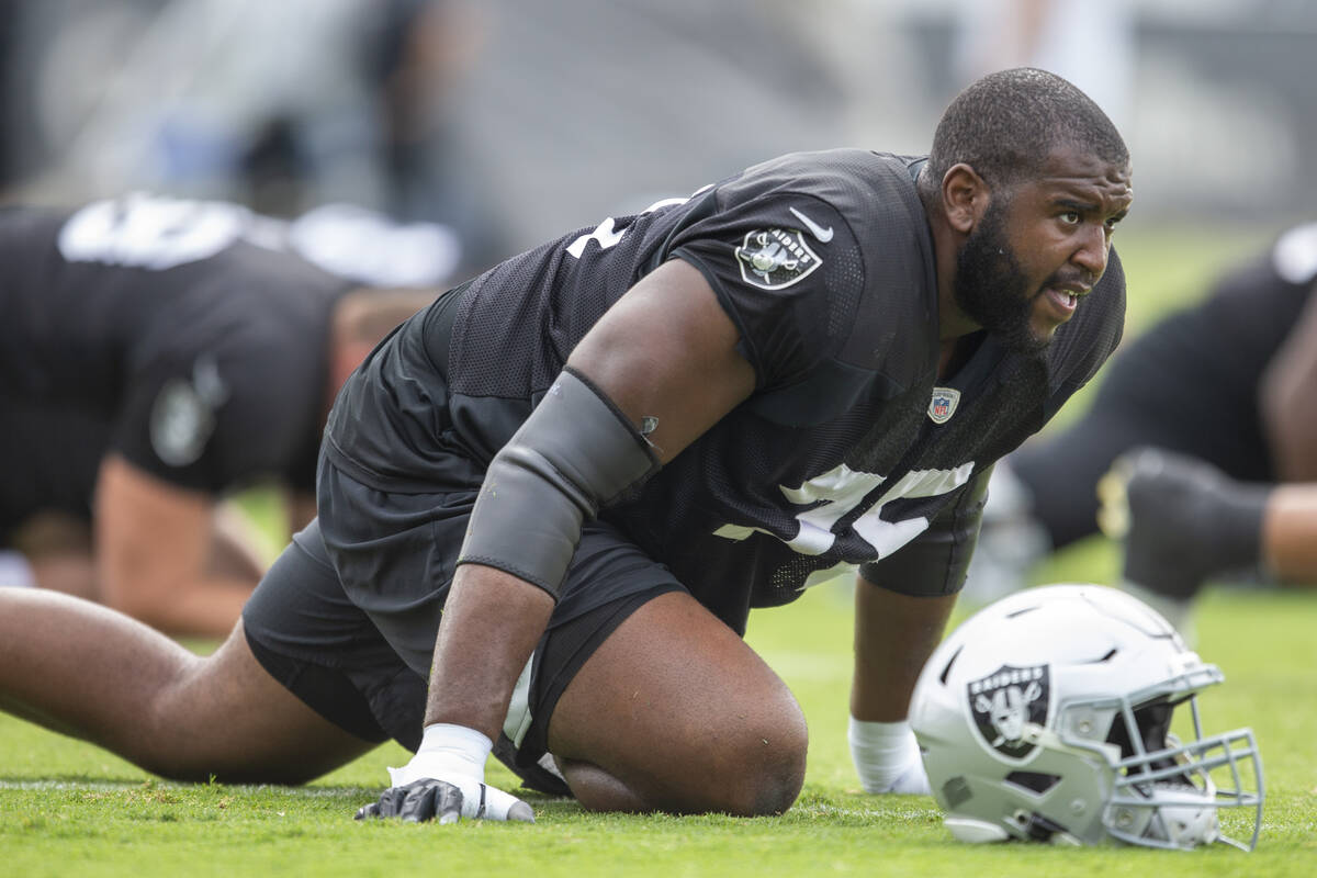 Raiders offensive tackle Brandon Parker (75) stretches during a practice session at the Raiders ...