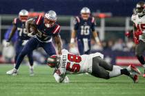 New England Patriots running back Damien Harris (37) is tackled by Tampa Bay Buccaneers linebac ...