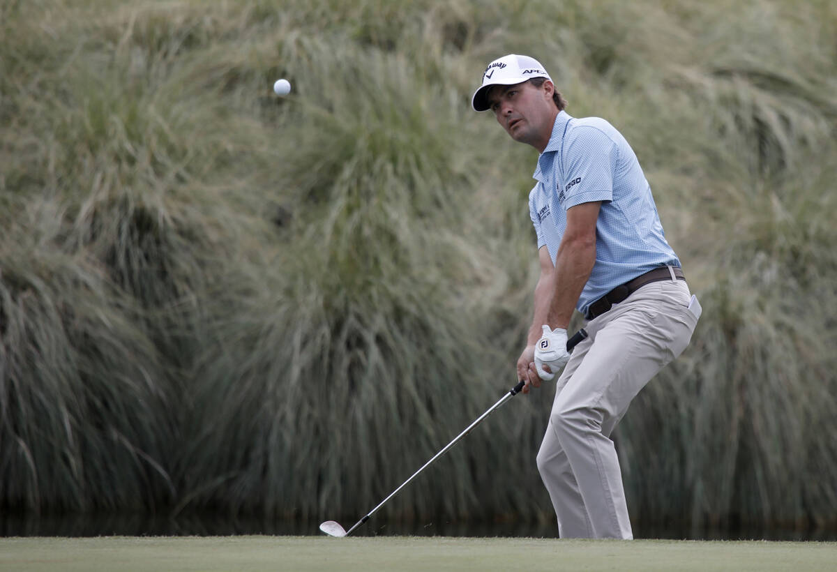 Kevin Kisner chips onto on the 18th green during the first round of the Shriners Hospitals for ...
