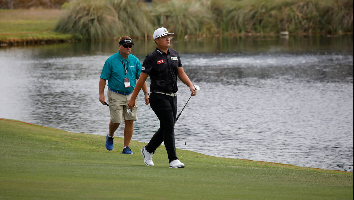 Sungjae Im of South Korea, right, walks to the 18th green during the first round of the Shriner ...