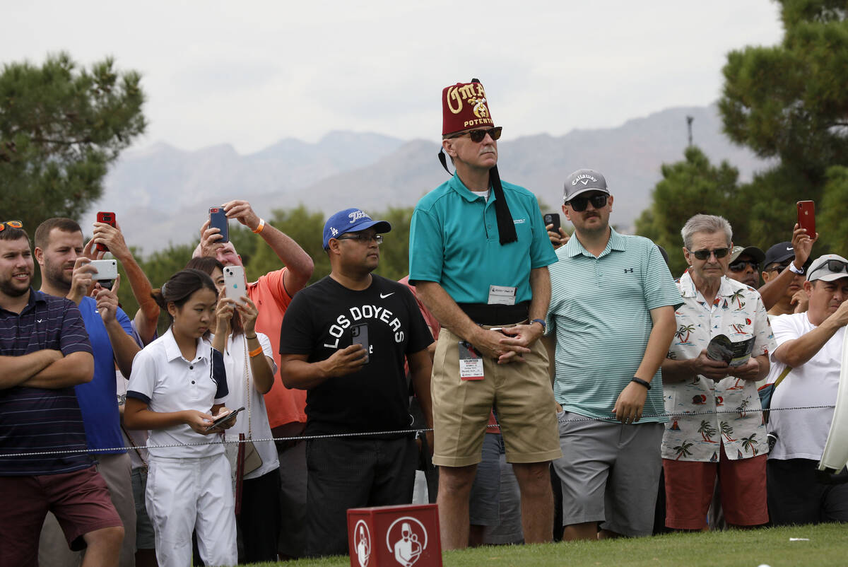 The gallery watches players on the first hole during the first round of the Shriners Hospitals ...