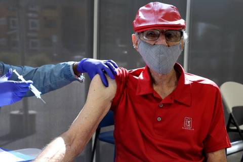 Charles "Buddy Charles" Wucinich, 84, of Las Vegas gets a Pfizer COVID-19 vaccine boo ...