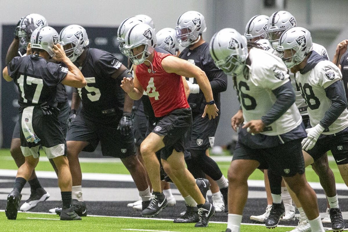 Raiders quarterback Derek Carr (4) leads the team during a practice session at the Raiders Head ...