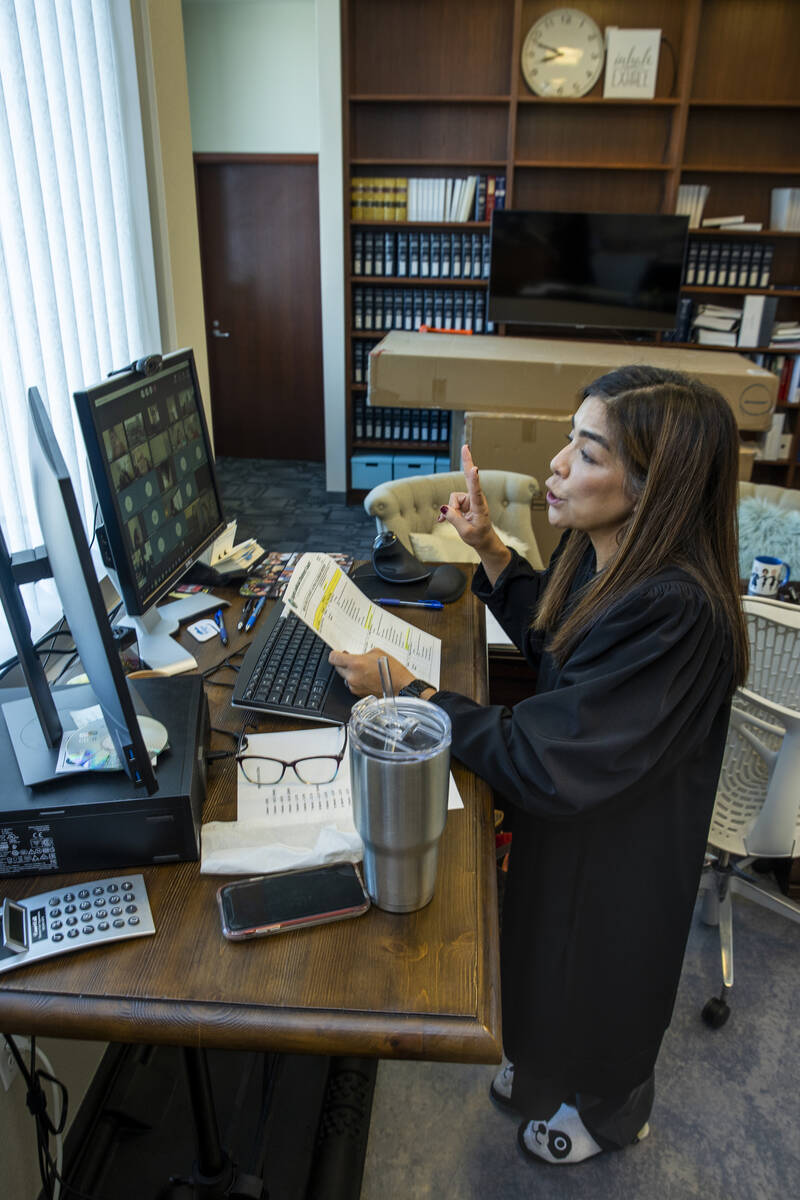District Judge Bita Yeager conducts mental health court remotely from her chambers at the Regio ...