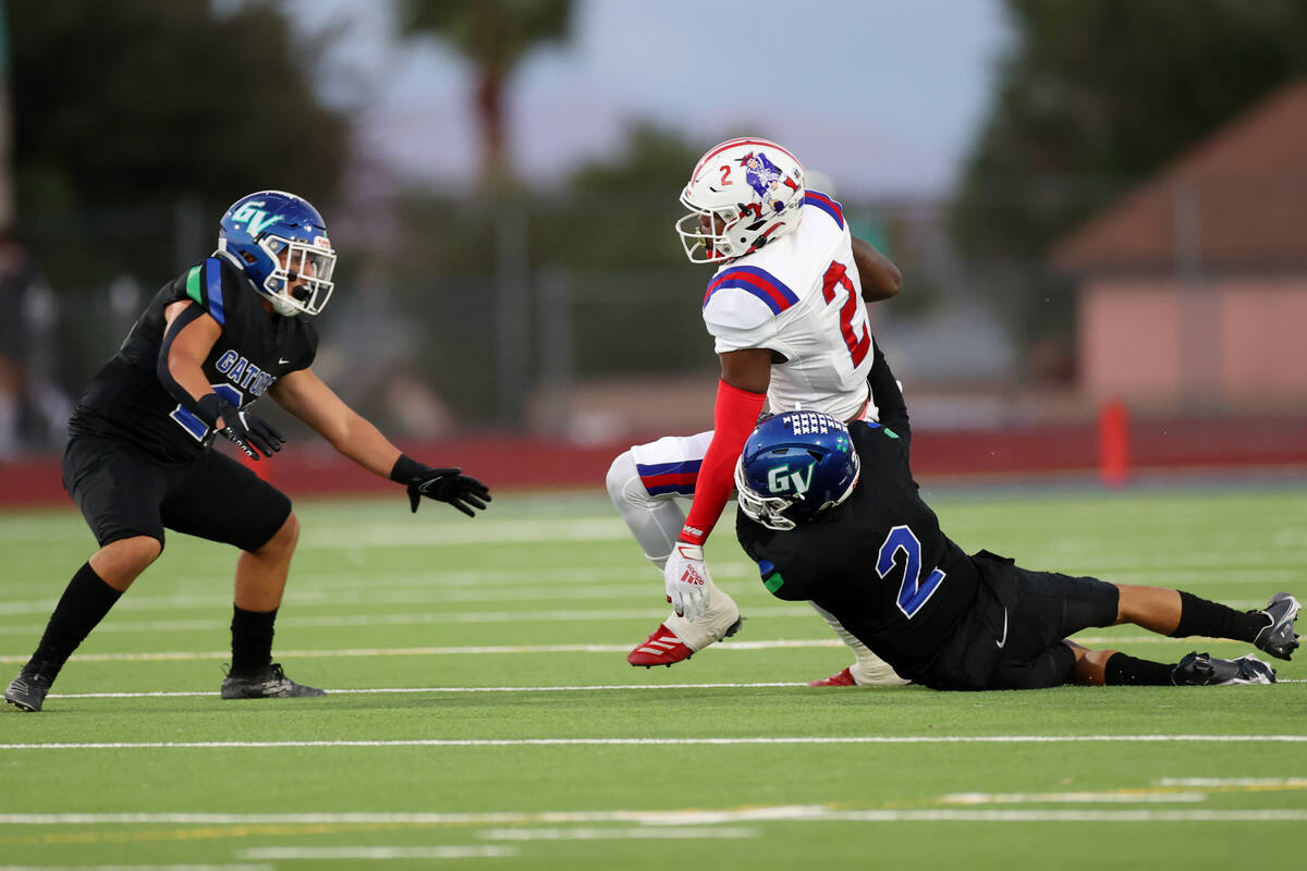 Liberty's Germie Bernard (2) is tackled by Green Valley's Kendall Ayersman (2) in the first hal ...