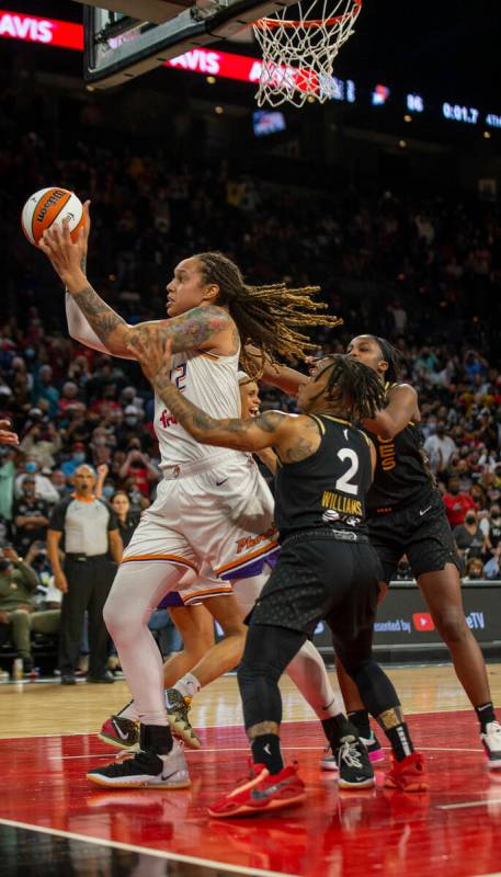 Phoenix Mercury center Brittney Griner (42) holds on to the basketball after swatting away a sh ...