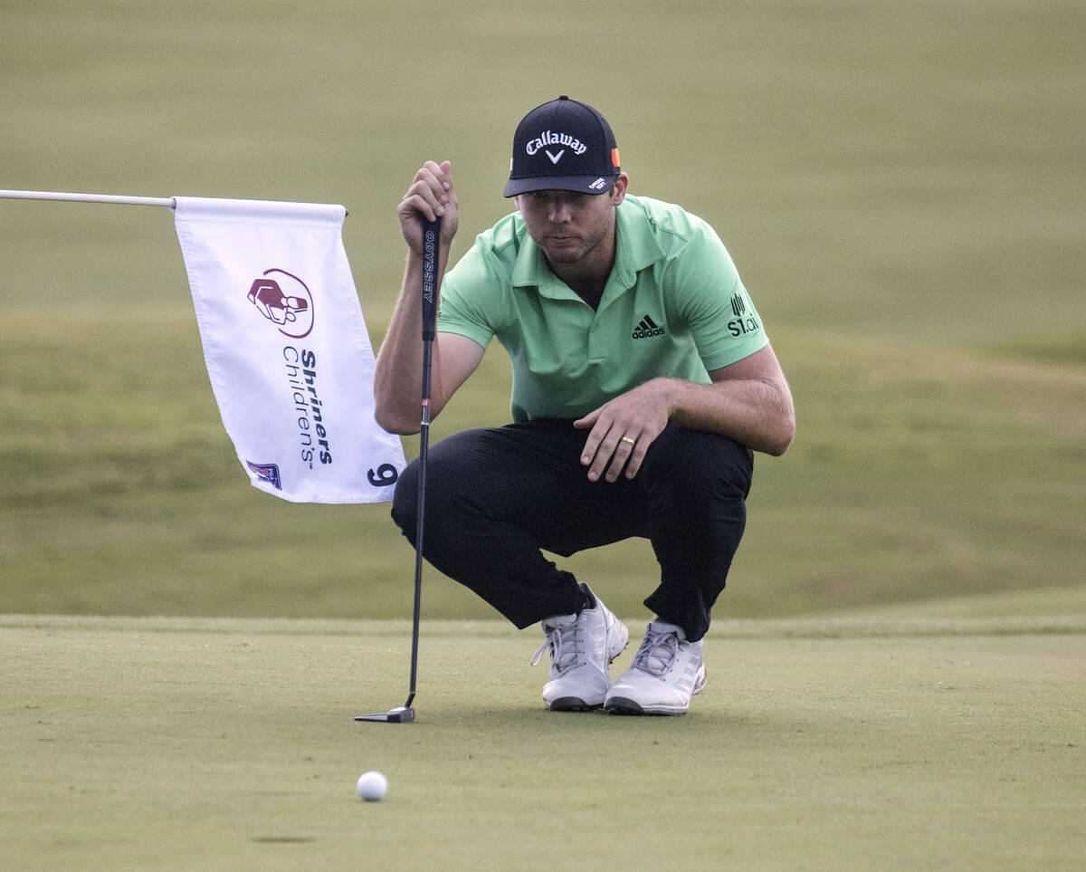 Sam Burns of Shreveport, La., lines up a putt at the 18th hole during the second round of the S ...