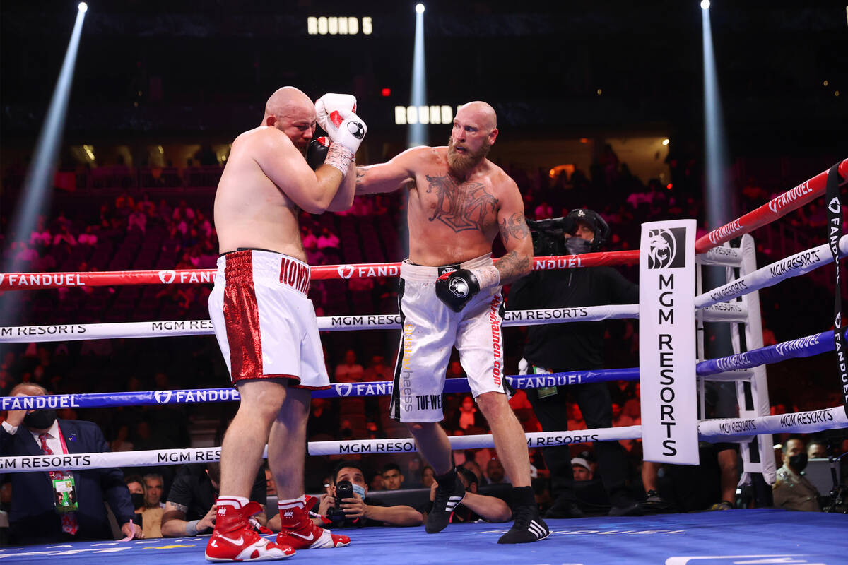 Robert Helenius, right, connects a punch against Adam Kownacki in the fifth round of a heavywei ...