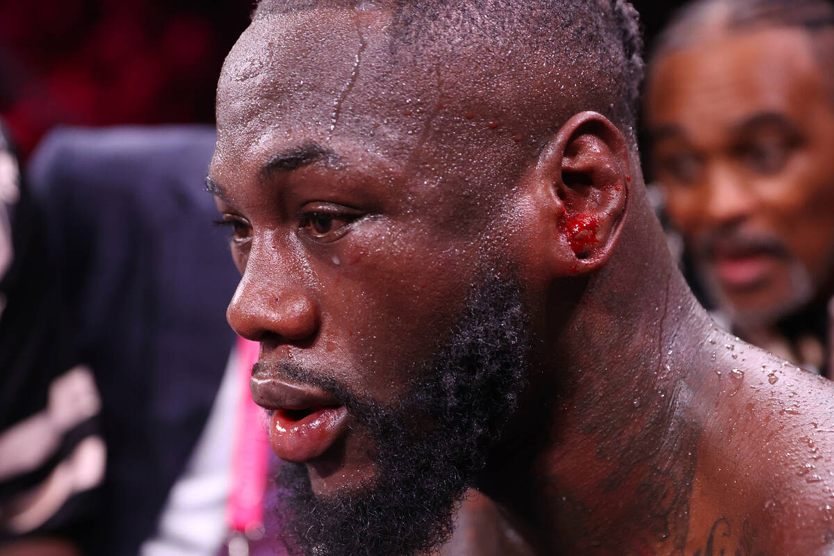 Deontay Wilder receives assistance after getting knocked out by Tyson Fury in the 11th round of ...
