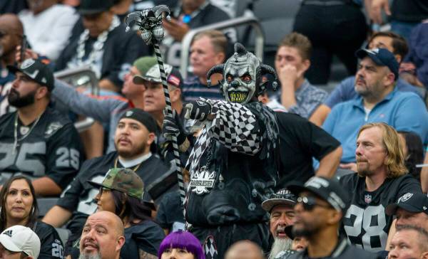 Raiders fan cheers during the third quarter of an NFL football game against the Chicago Bears o ...