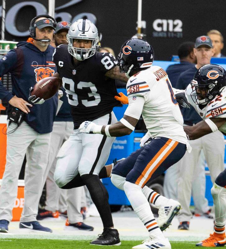 Raiders tight end Darren Waller (83) pushed out of bound by Chicago Bears free safety Eddie Jac ...