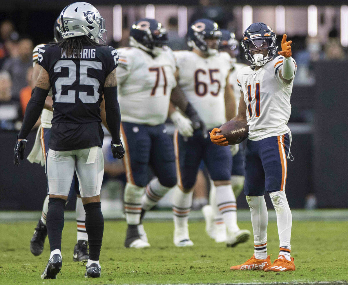 Chicago Bears wide receiver Darnell Mooney (11) signals a first down in front of Raiders free s ...