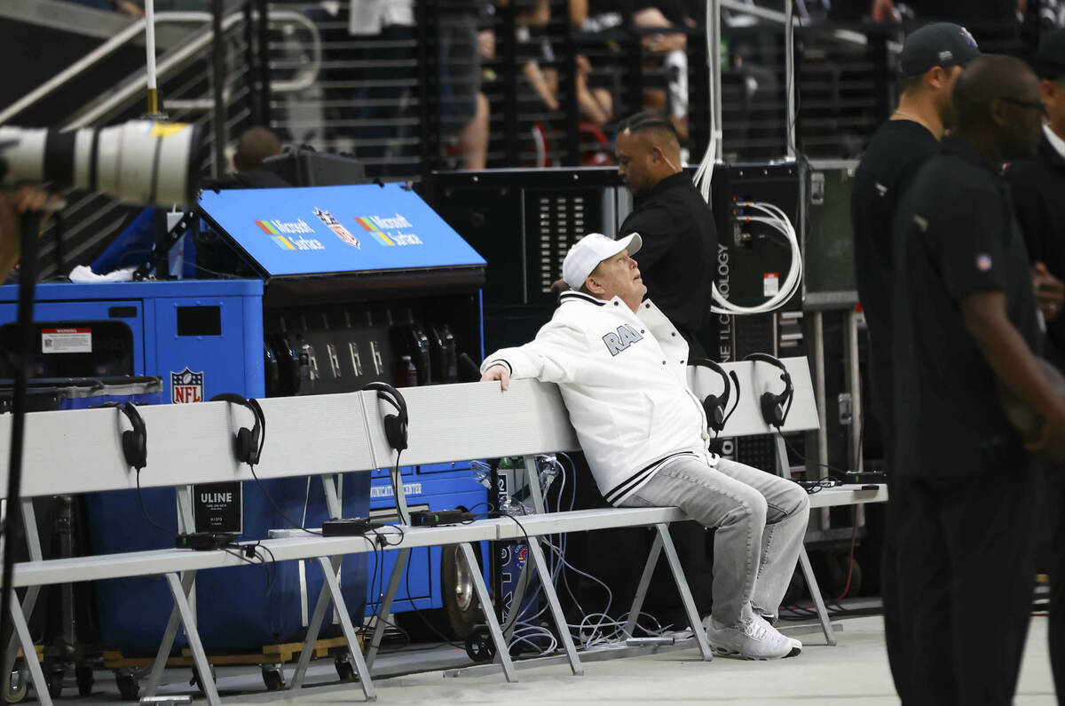 Raiders owner Mark Davis sits on the team bench before the start of an NFL game against the Chi ...