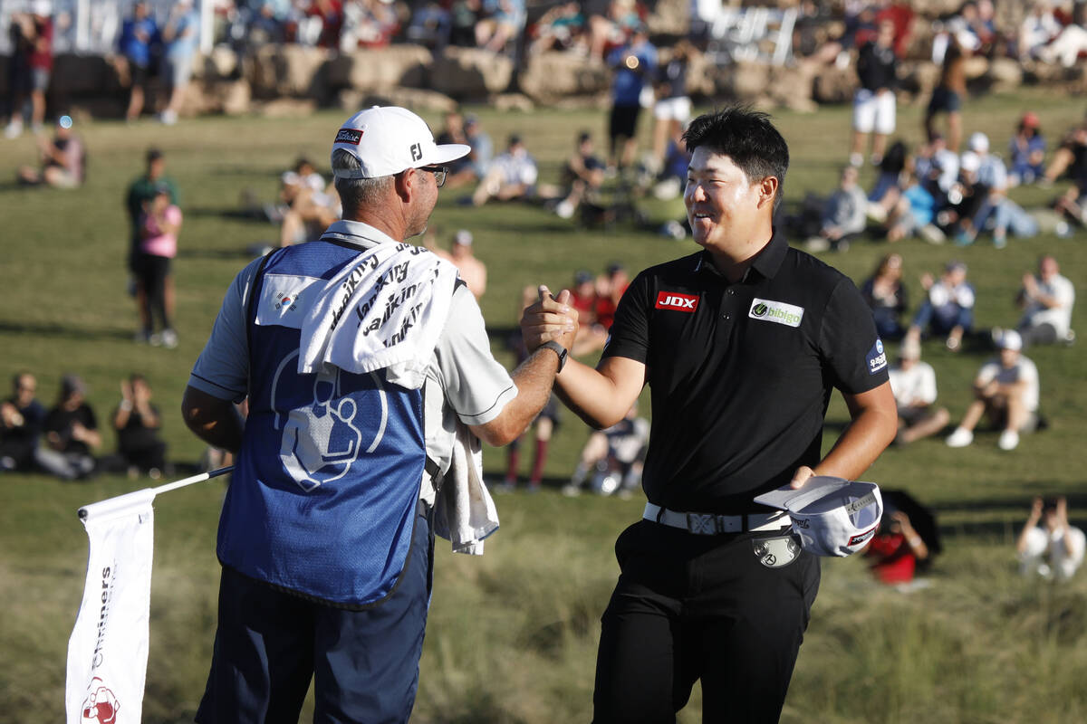 Sungjae Im, right, celebrates with his caddie after he won the final round of the Shriners Hosp ...