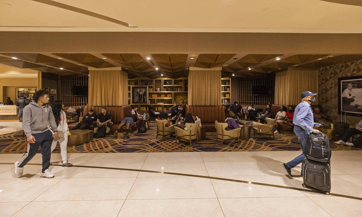 Guests wait in the lobby during a partial power outage at Sahara Las Vegas on Monday, Oct. 11, ...