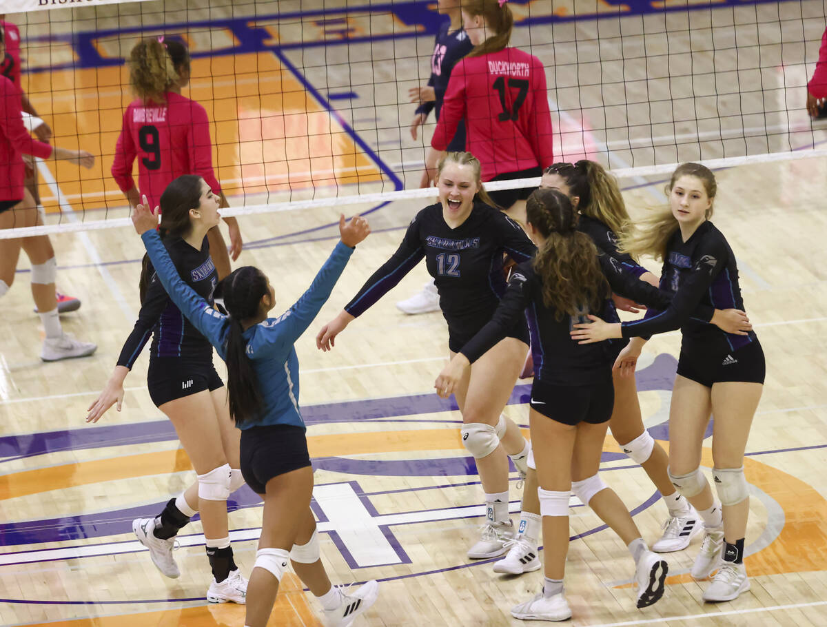 Silverado players celebrate after a play during a volleyball game at Bishop Gorman High School ...