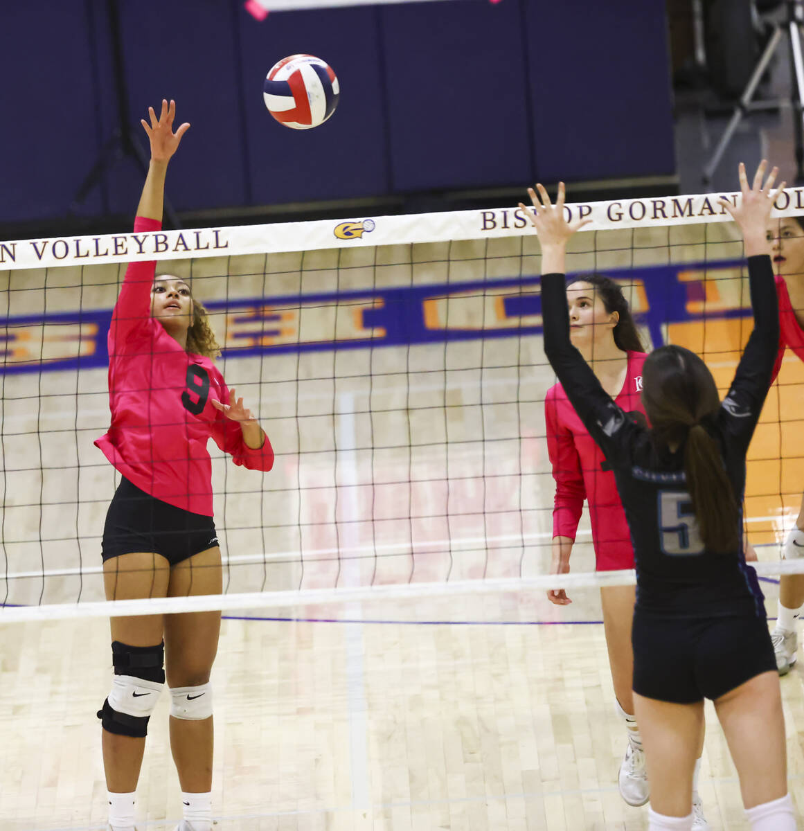 Bishop Gorman's outside hitter Imani Dambreville (9) hits the ball during a volleyball game at ...