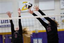Faith Lutheran's Bianca Richardson (6) and Delaney Wilson (12) attempt to kill a Durango spike ...