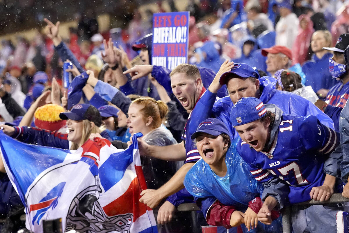 Buffalo Bills fans celebrate late in an NFL football game against the Kansas City Chiefs Sunday ...
